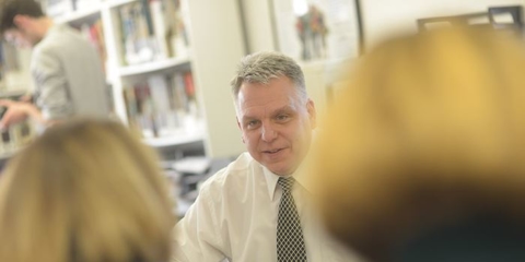 Franchise owner talking with colleagues