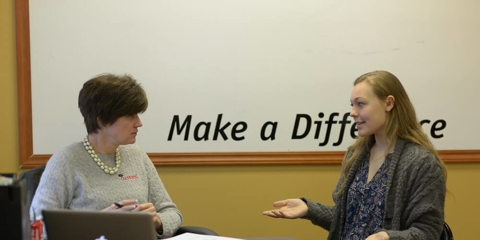 Two women discussing