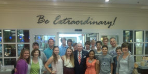 College students on school trip with company owner