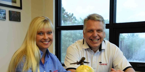 Tom and Izzo smiling