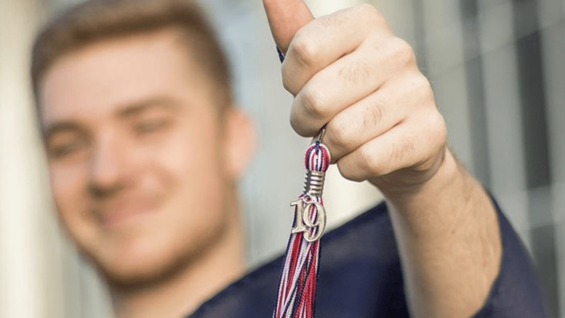 Man holding a medal