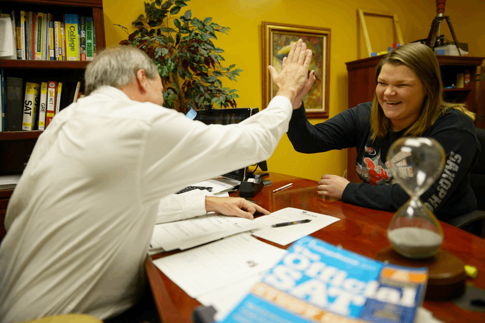 Two people doing a high five