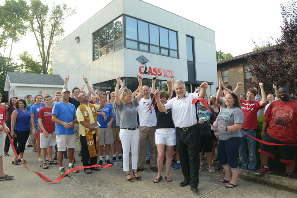 People happily celebrating ribbon cutting