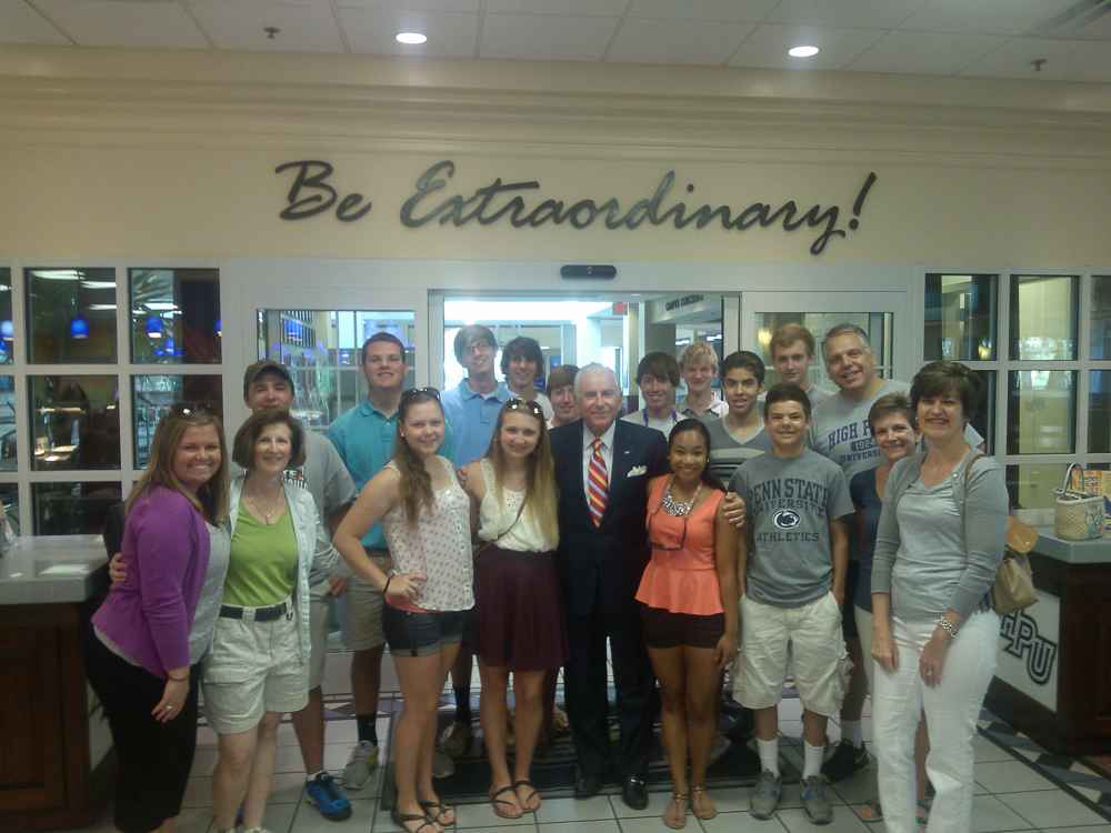 College students on school trip with company owner