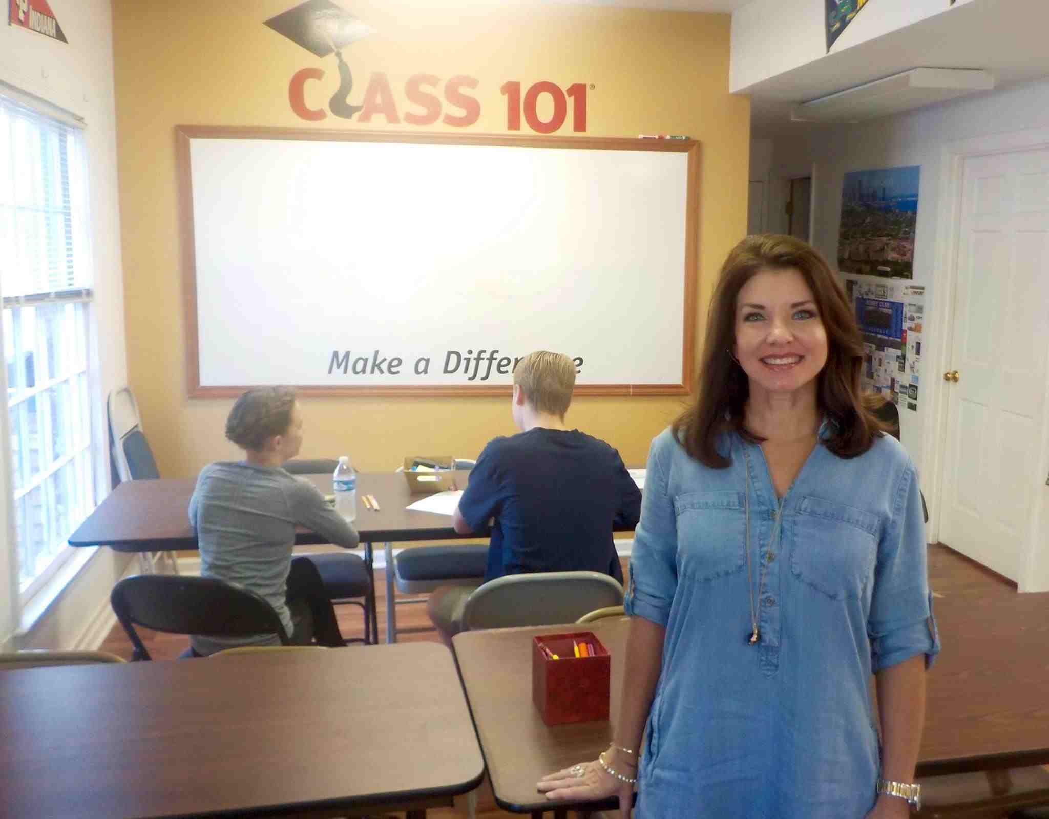 Woman in a classroom smiling